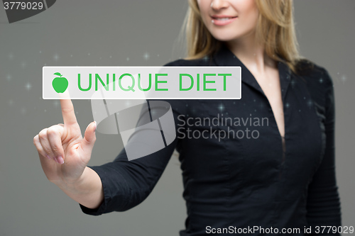 Image of woman presses the button on virtual screens. touch screen. unique diet