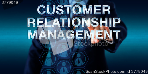 Image of Manager Touching CUSTOMER RELATIONSHIP MANAGEMENT