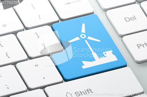 Image of Manufacuring concept: Windmill on computer keyboard background