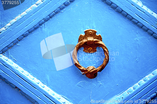 Image of blue metal rusty  brown    morocco in africa   safe padlock 