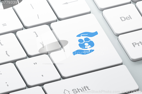 Image of Insurance concept: Family And Palm on computer keyboard background