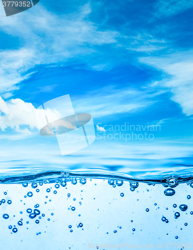 Image of Close up water on a background of blue sky