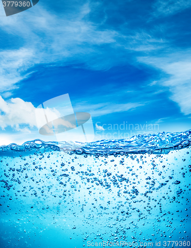 Image of Close up water on a background of blue sky