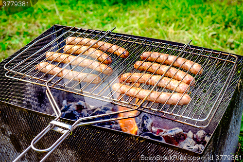 Image of Grilling sausages