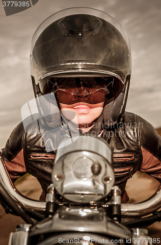 Image of Biker girl on a motorcycle