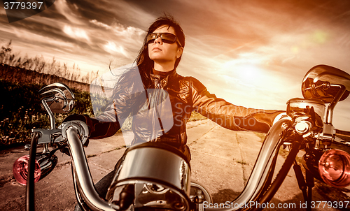 Image of Biker girl on a motorcycle