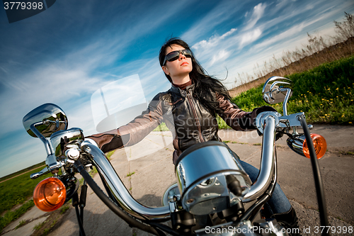 Image of Biker girl on a motorcycle