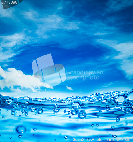 Image of Close up water on a background of blue sky