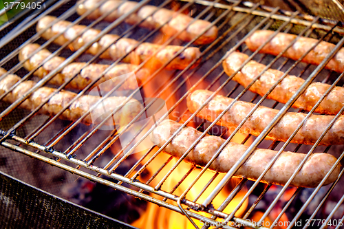 Image of Grilling sausages