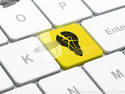 Image of Finance concept: Light Bulb on computer keyboard background