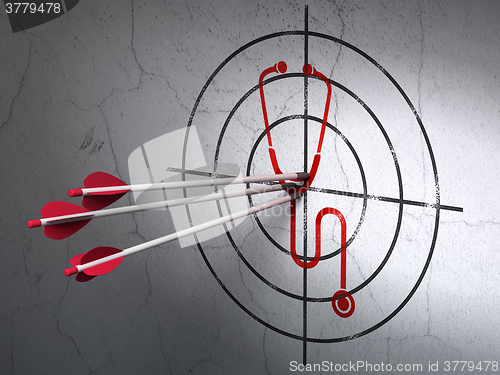 Image of Medicine concept: arrows in Stethoscope target on wall background