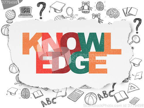 Image of Learning concept: Knowledge on Torn Paper background