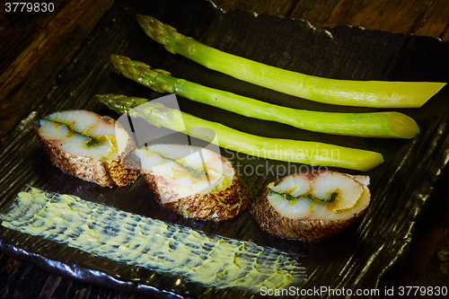 Image of fish fillet with green asparagus