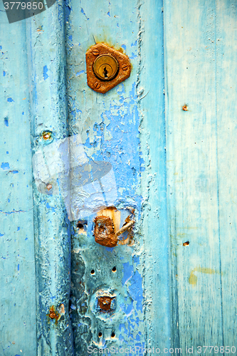 Image of   metal     nail dirty stripped paint in the blue woo  knocker