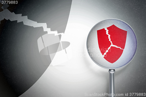 Image of Protection concept:  Broken Shield with optical glass on digital background