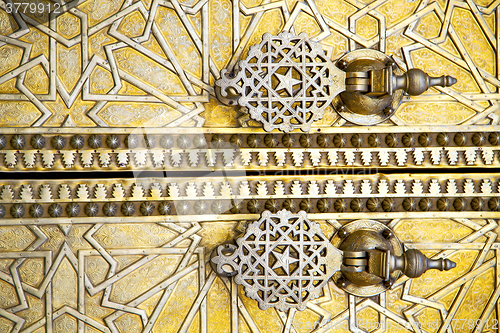 Image of metal rusty  brown    morocco in gold   facade home and safe pad