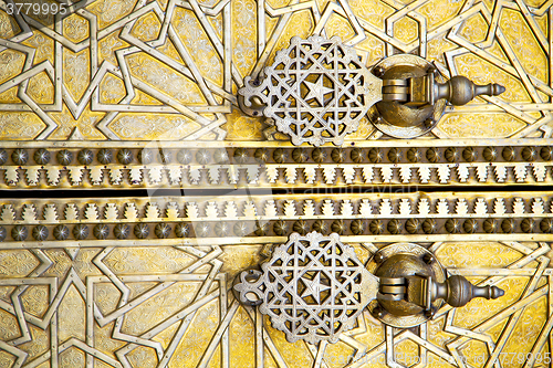 Image of metal rusty  brown    morocco in gold   facade home and safe pad