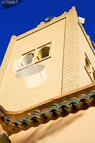 Image of  the history  symbol  in morocco  green roof and  blue    sky