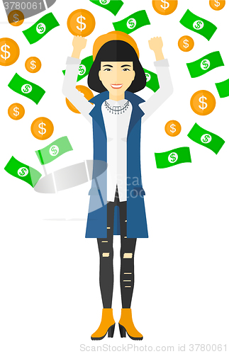 Image of Happy woman with  flying money. 