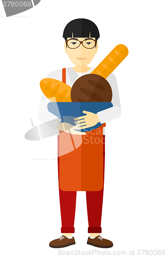 Image of Bakery owner with bread.