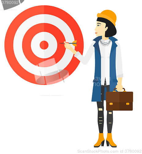 Image of Business woman with target board.