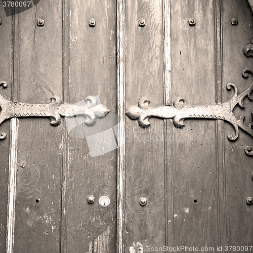 Image of brown wooden parliament in london old  door and marble antique  