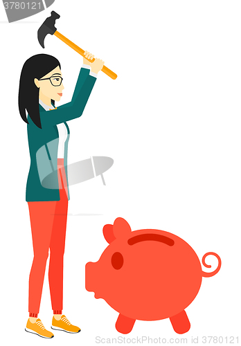 Image of Woman breaking piggy bank.