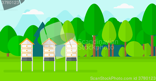 Image of Background of beehives in meadow.