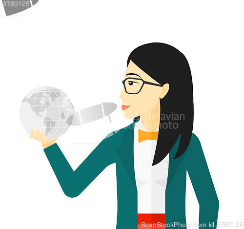 Image of Woman holding globe.