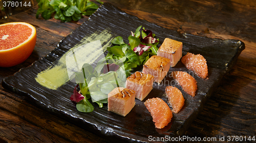 Image of Grill salmon salad, with mixed greens, avocado,grapefruit. Delicious healthy eating.