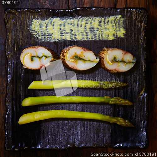 Image of fish fillet with green asparagus