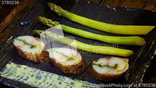Image of fish fillet with green asparagus