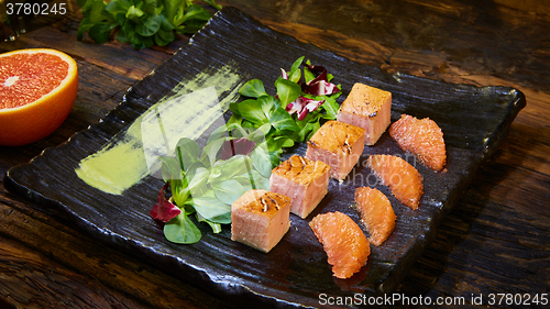 Image of Grill salmon salad, with mixed greens, avocado,grapefruit. Delicious healthy eating.