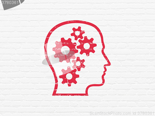 Image of Advertising concept: Head With Gears on wall background