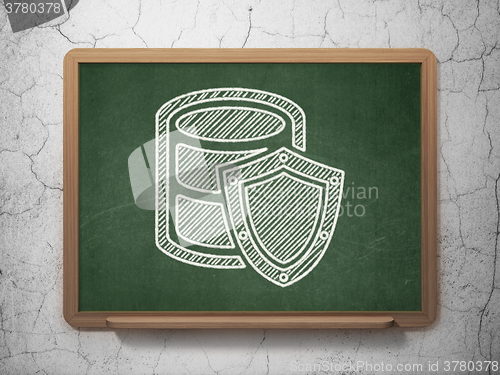 Image of Programming concept: Database With Shield on chalkboard background