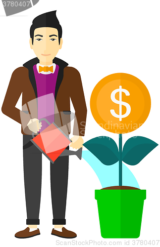 Image of Man watering money flower.