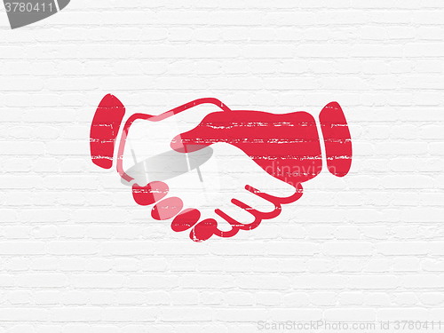 Image of Political concept: Handshake on wall background