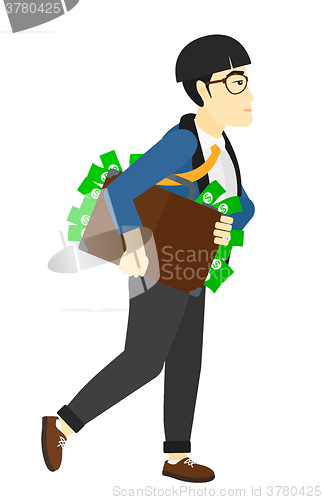 Image of Man with suitcase full of money.