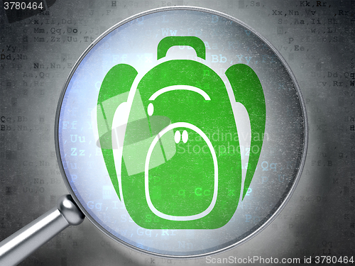 Image of Education concept: Backpack with optical glass on digital background