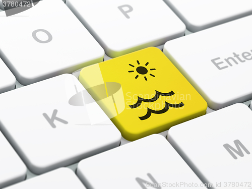 Image of Tourism concept: Beach on computer keyboard background