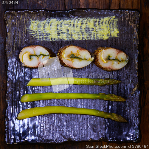 Image of fish fillet with green asparagus