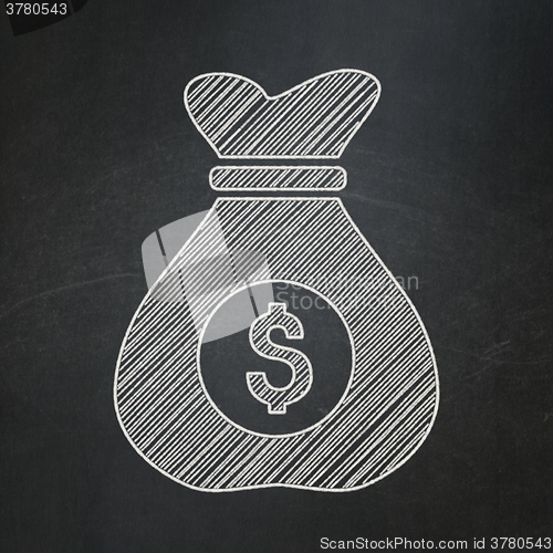 Image of Finance concept: Money Bag on chalkboard background