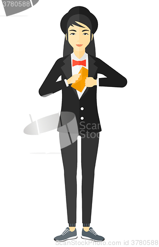 Image of Woman putting envelope in pocket.