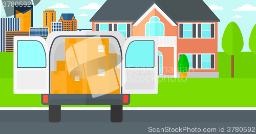 Image of Background of delivery truck with an open door and cardboard boxes in front of house.