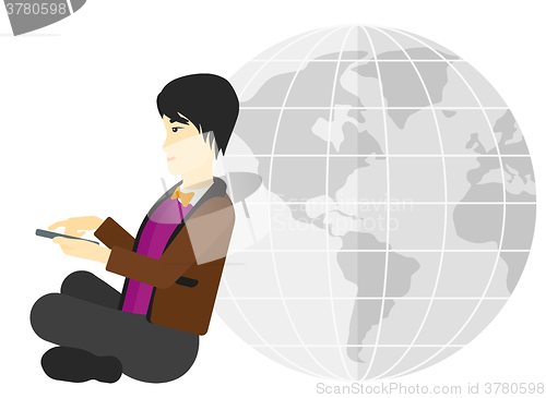 Image of Man sitting near globe.