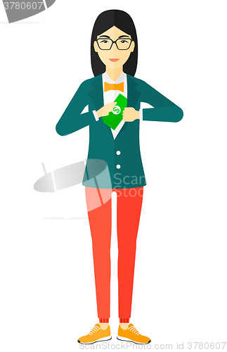 Image of Woman putting money in pocket.