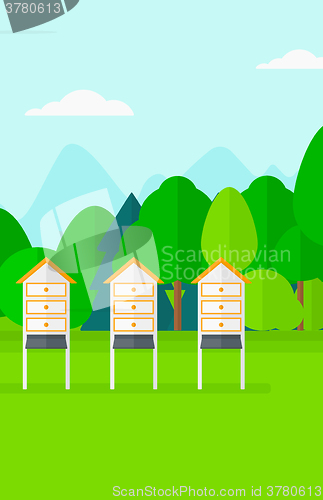 Image of Background of beehives in meadow.