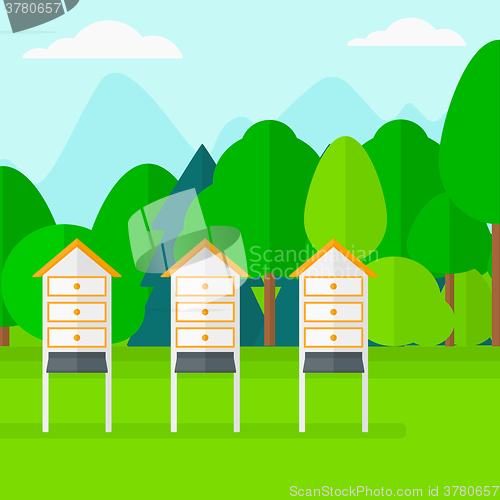 Image of Background of beehives in meadow.