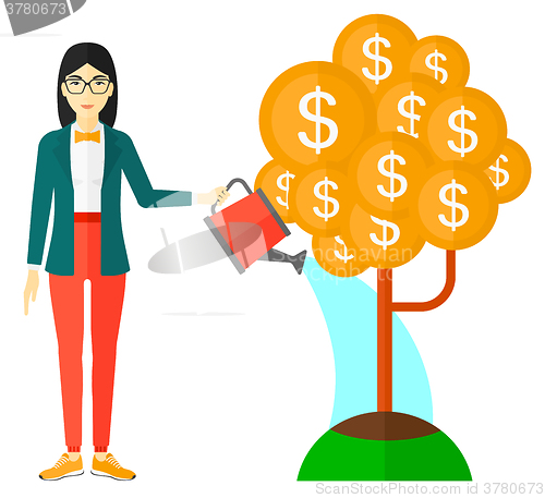 Image of Woman watering money tree.