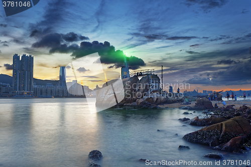 Image of Light House at sea Cove at Sunset